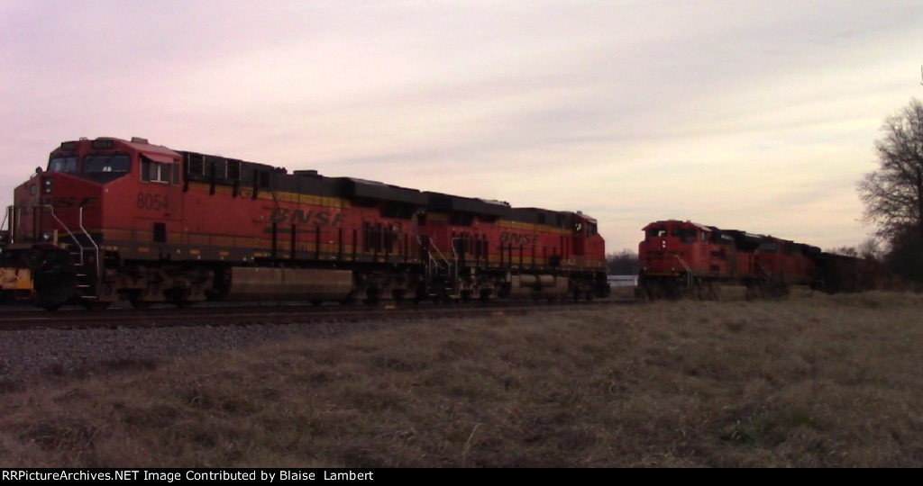 BNSF local meets a coal empty